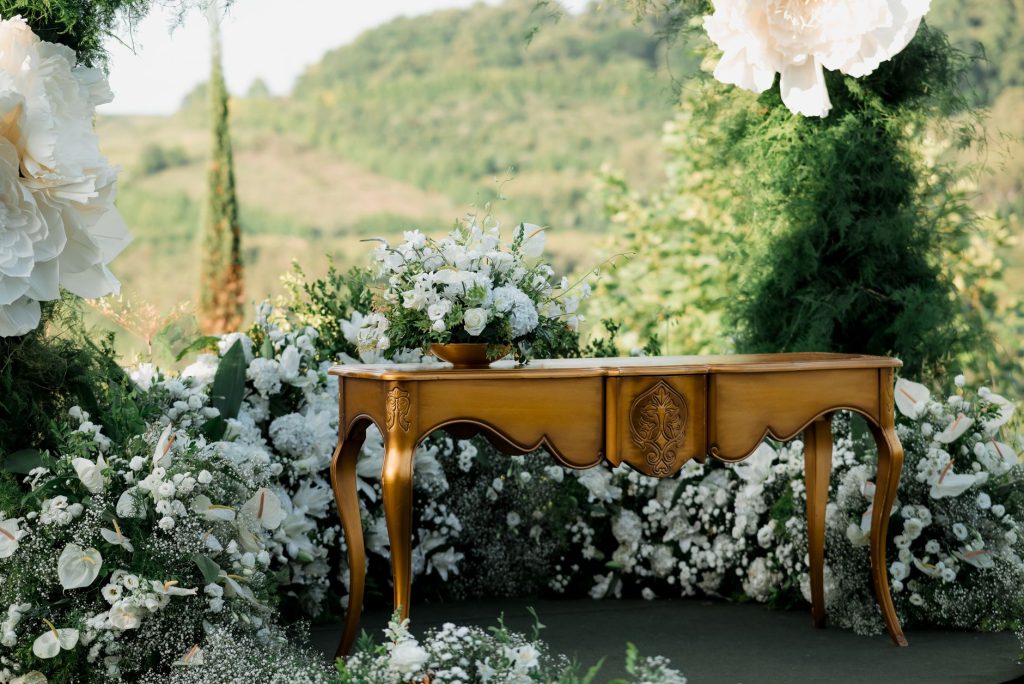 Charming outdoor wedding setup with elegant floral decor and vintage wooden table. — A Guide To Help You Select The Right Mat