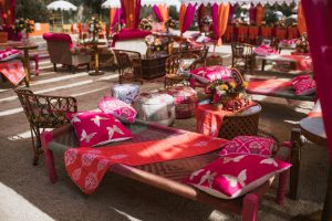 Colorful outdoor lounge area with vibrant textiles and seating arrangement at an event. — Bedroom lighting ideas to improve t