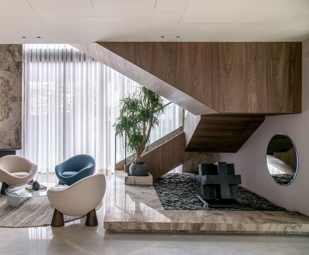 Chic interior showcasing a modern staircase, elegant seating, and decorative elements. — Beginner Cake Decorating Techniques