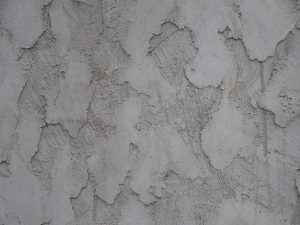 Background, stucco, wall — Common Issues That Require Plumbing Excavation