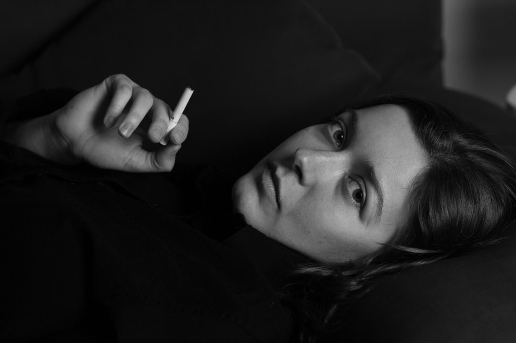 Woman, cigarette, smoking — How Drug Rehab in Morristown NJ Offers Personalized Treatment Plans