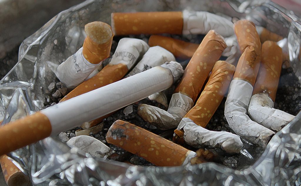 Cigarettes, ashtray, ash — Low-Cost Online TRT Clinics for Affordable Health Solutions
