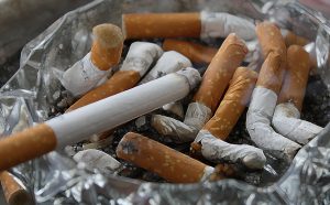 Cigarettes, ashtray, ash — Low-Cost Online TRT Clinics for Affordable Health Solutions