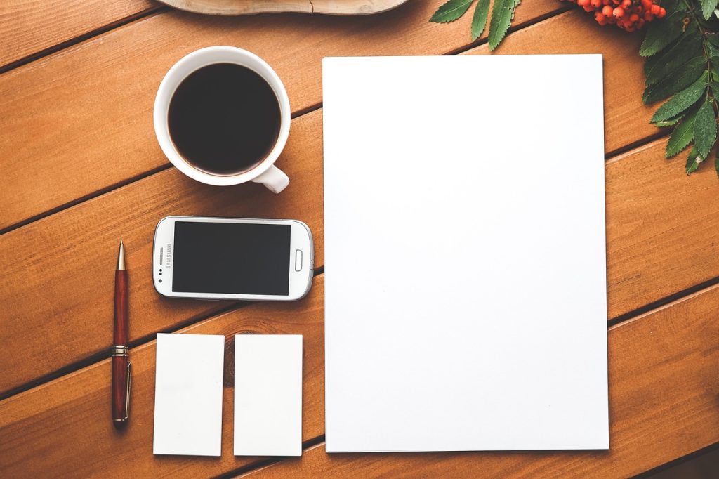 Coffee, phone, paper — Making a Difference in Peru: A TEFL Story
