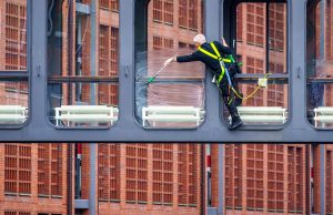 Glass cleaning, clean windows, workers — The Comprehensive Guide to Janitorial Services in Fort Worth
