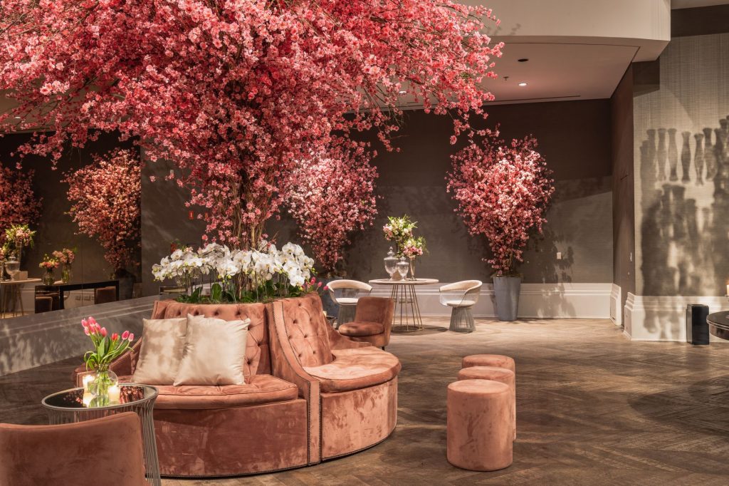 Elegant indoor lounge featuring cherry blossom decorations and plush seating for a sophisticated ambiance. — Transform Your W