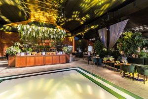 A modern banquet hall with elegant floral arrangements and ambient lighting, perfect for celebrations. — Which Is The Right B